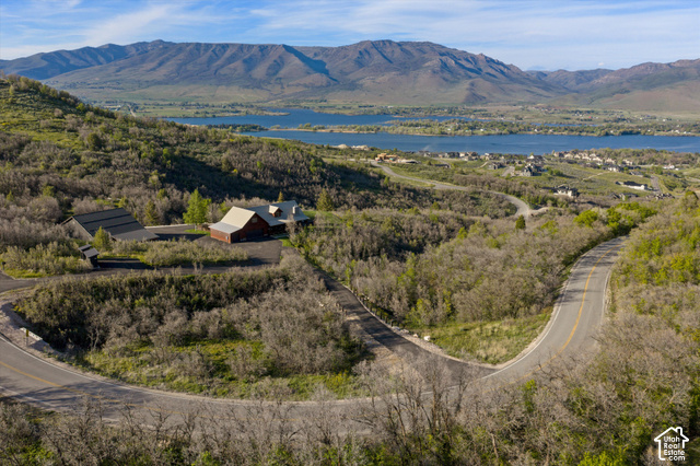 5878 Snowbasin Road Huntsville, UT 84317 - Photo 88 of 90 Expansive mountain and lake scenery with a winding paved road leading to the property
