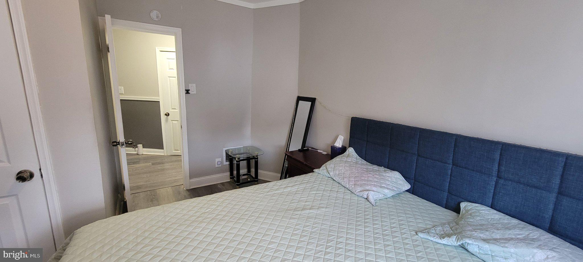 209 North 10th Street Darby, PA 19023 - Photo 21 of 26 Cozy bedroom with inviting ambiance.