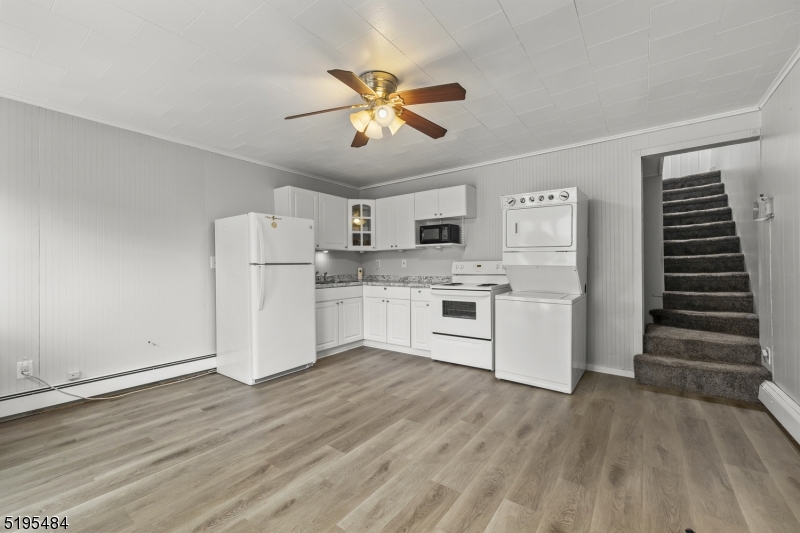 5 North Main Street Wharton, NJ 07885 - Photo 2 of 10 a kitchen with stainless steel appliances a white cabinets and wooden floor
