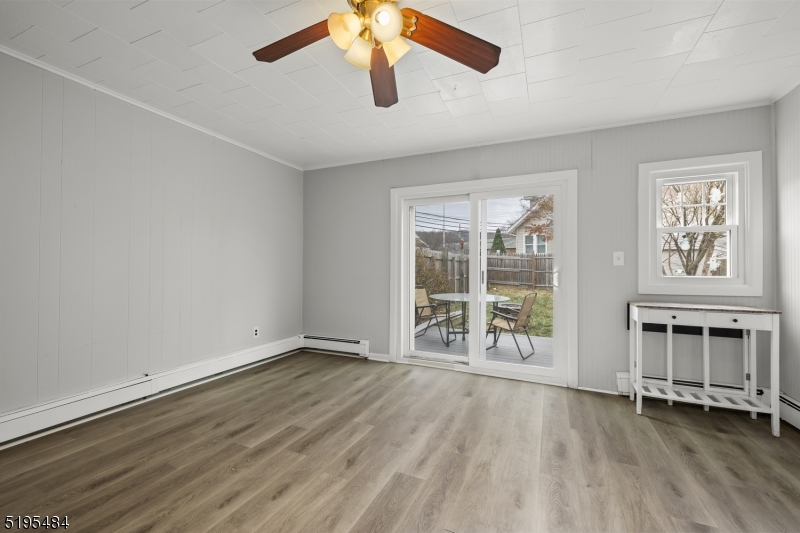5 North Main Street Wharton, NJ 07885 - Photo 3 of 10 wooden floor in an empty room with a window