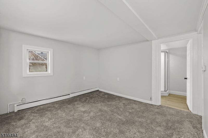 5 North Main Street Wharton, NJ 07885 - Photo 5 of 10 an empty room with a empty space and window