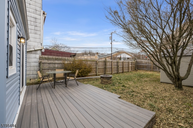 5 North Main Street Wharton, NJ 07885 - Photo 9 of 10 a view of a roof deck with table and chairs and wooden floor
