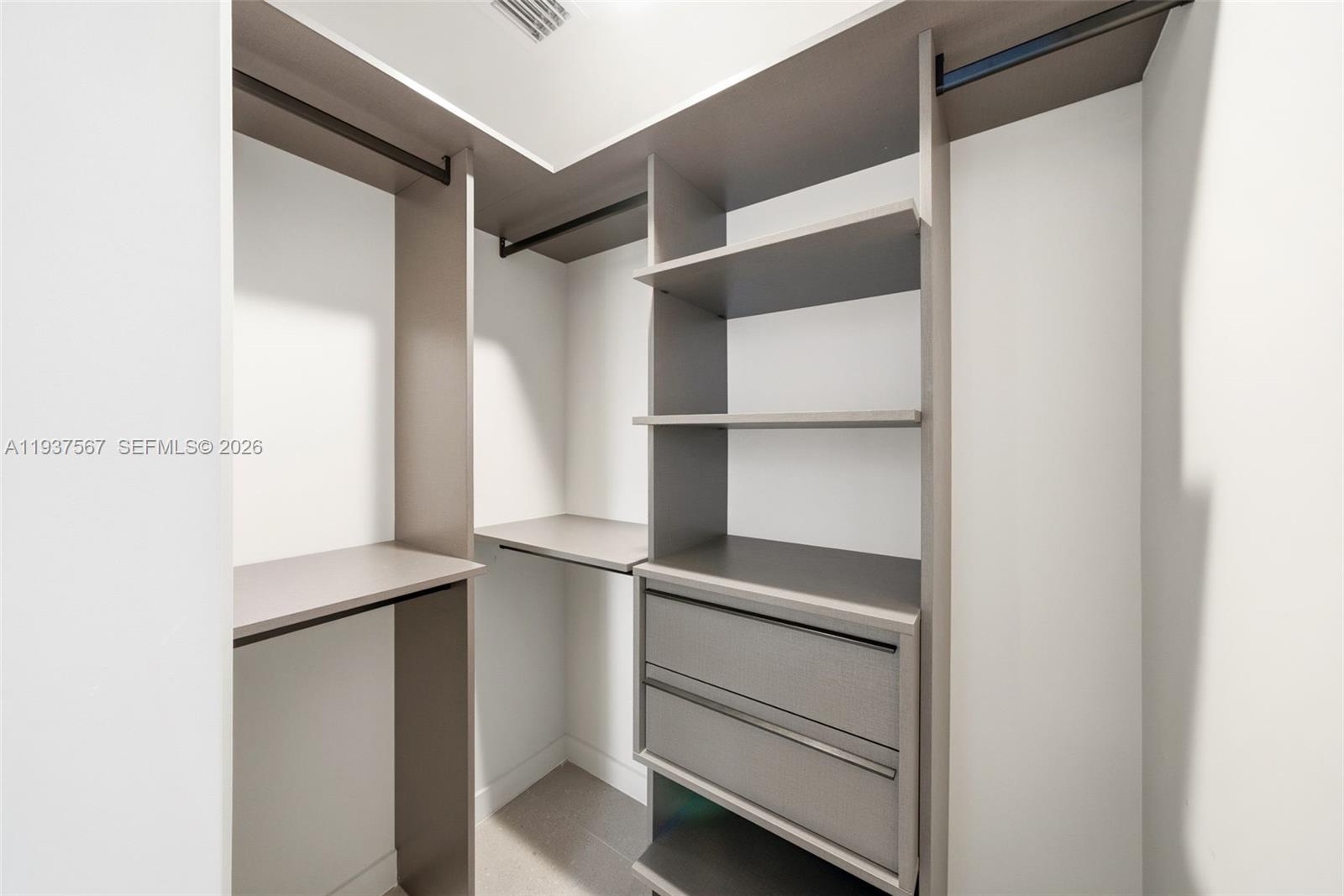 11 Northeast 6th Street, Unit 709 Miami, FL 33132 - Photo 20 of 54 a view of walk in closet with empty racks