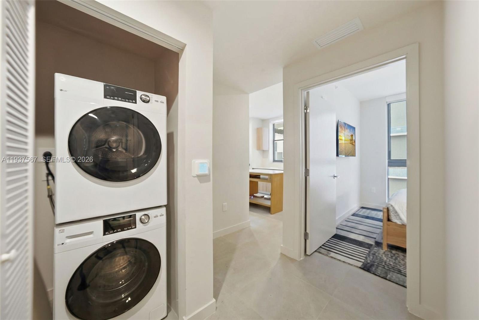 11 Northeast 6th Street, Unit 709 Miami, FL 33132 - Photo 21 of 54 a view of a hallway with washer and dryer