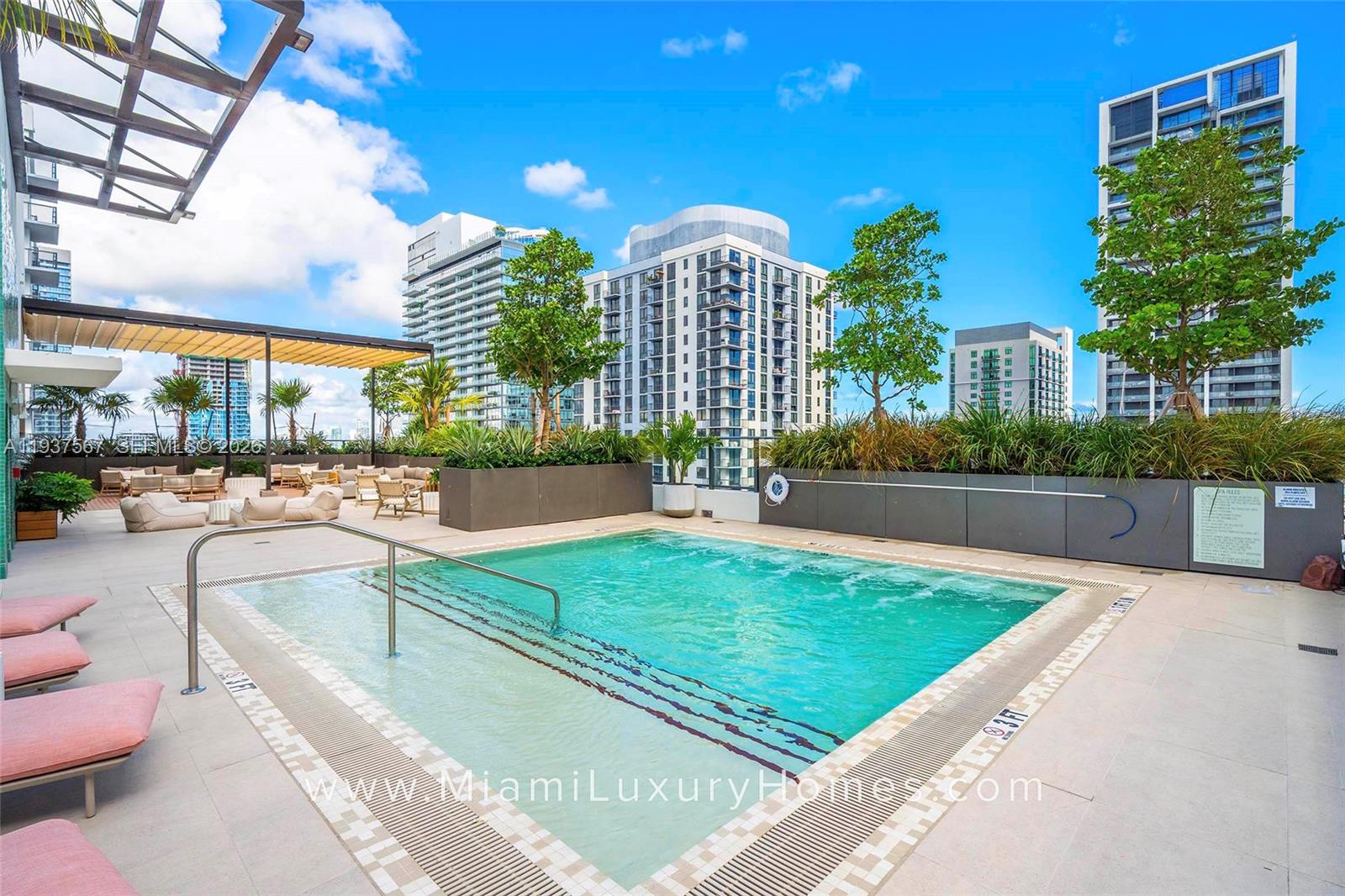 11 Northeast 6th Street, Unit 709 Miami, FL 33132 - Photo 23 of 54 a swimming pool with outdoor seating and yard