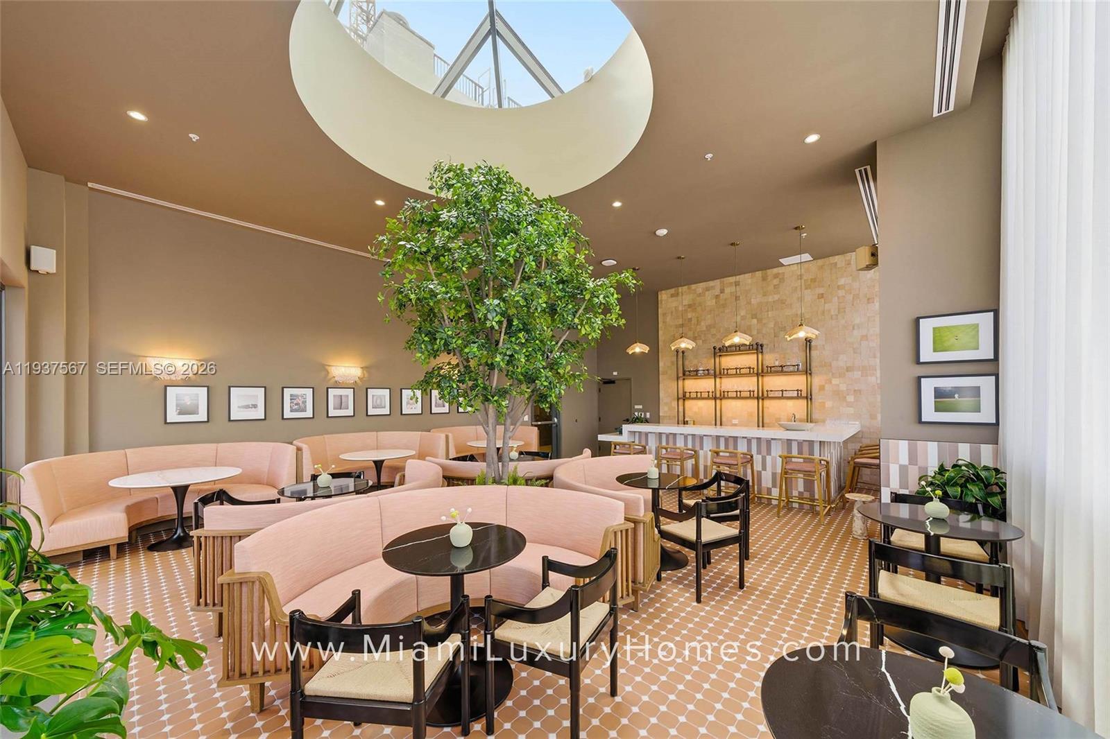 11 Northeast 6th Street, Unit 709 Miami, FL 33132 - Photo 27 of 54 a view of a dining room with furniture and wooden floor