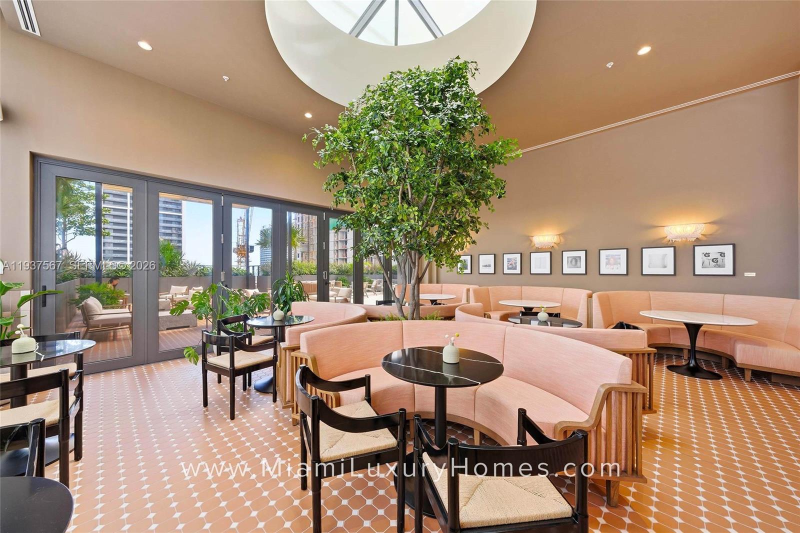 11 Northeast 6th Street, Unit 709 Miami, FL 33132 - Photo 28 of 54 a dining room with furniture and a large window