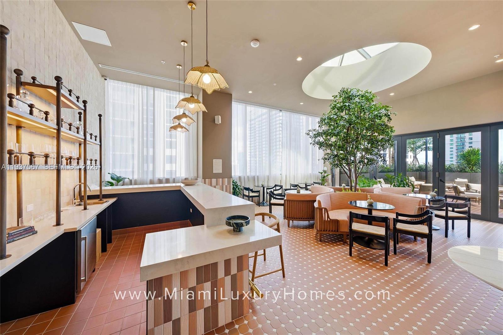 11 Northeast 6th Street, Unit 709 Miami, FL 33132 - Photo 30 of 54 a very nice looking living room with a large window and a chandelier