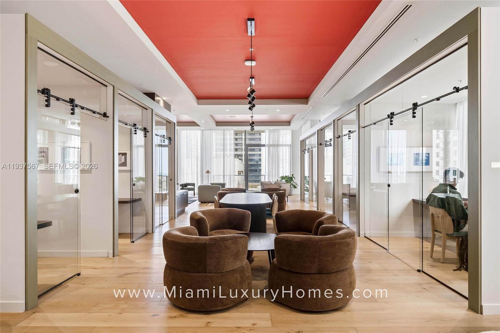 11 Northeast 6th Street, Unit 709 Miami, FL 33132 - Photo 35 of 54 a living room with furniture and a floor to ceiling window