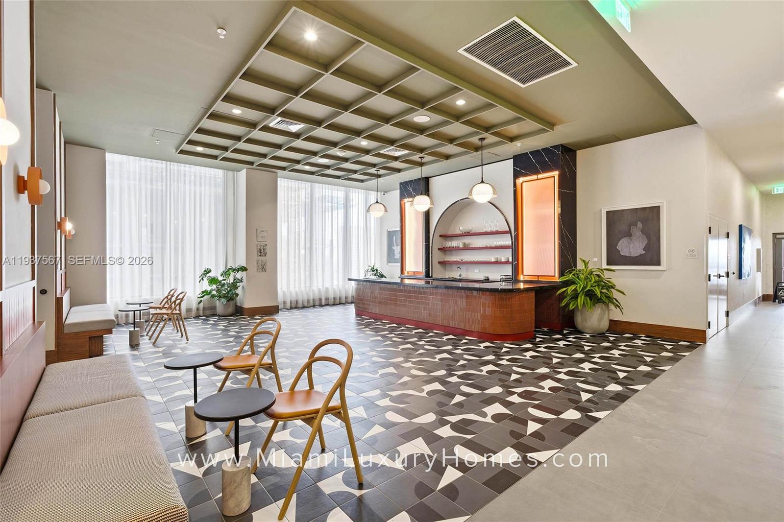 11 Northeast 6th Street, Unit 709 Miami, FL 33132 - Photo 38 of 54 a outdoor space with lots of furniture and chandelier