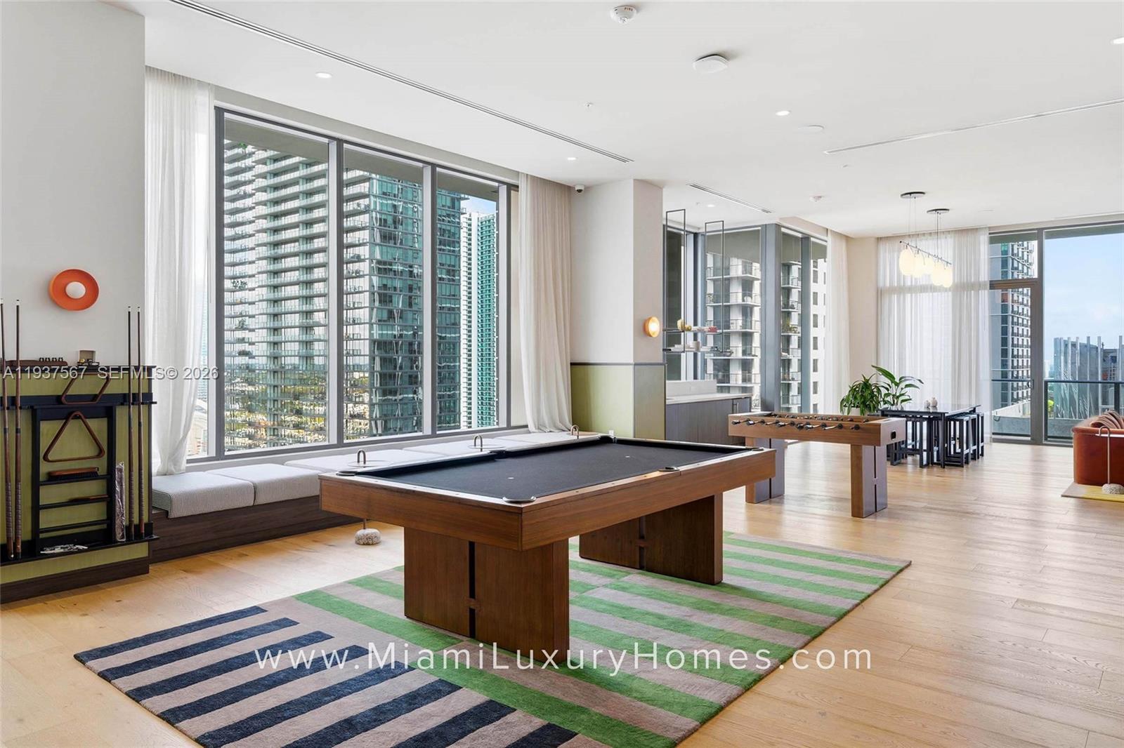 11 Northeast 6th Street, Unit 709 Miami, FL 33132 - Photo 40 of 54 a living room with furniture and large windows