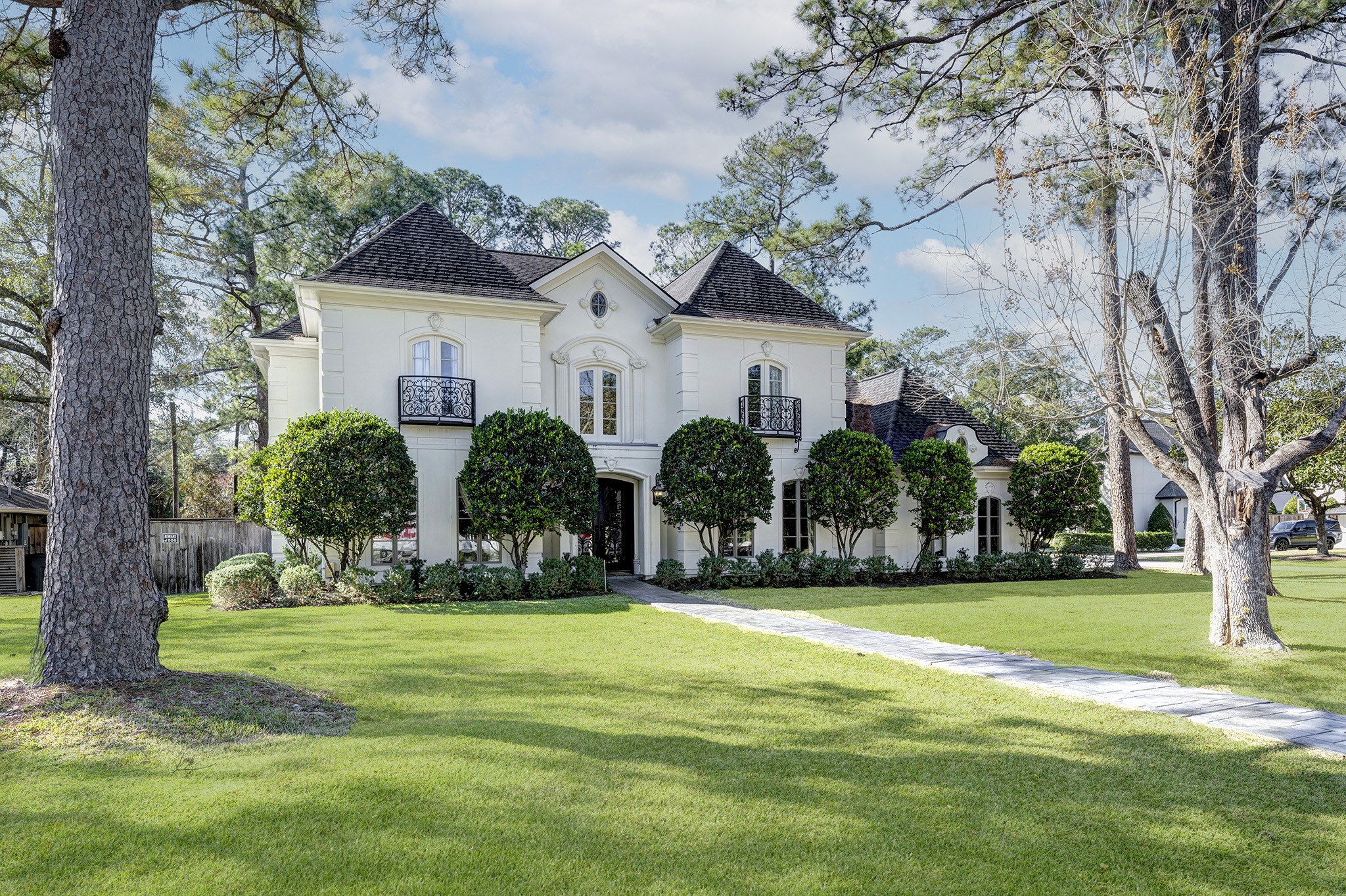 a front view of house with yard and green space