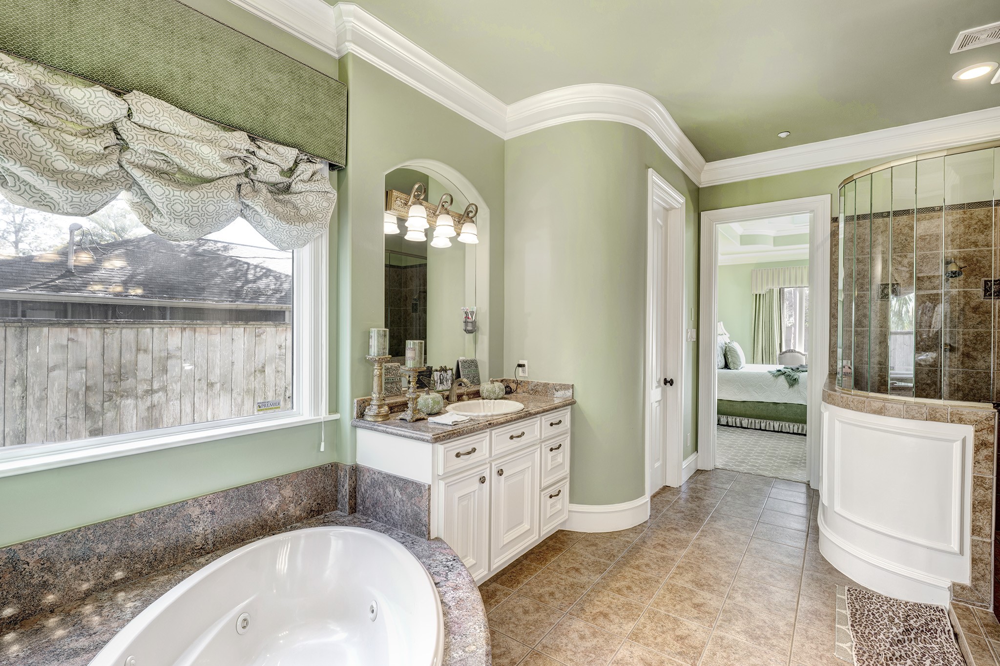 725 Blalock Road Houston, TX 77024 - Photo 12 of 27 a bathroom with a sink a vanity and a mirror