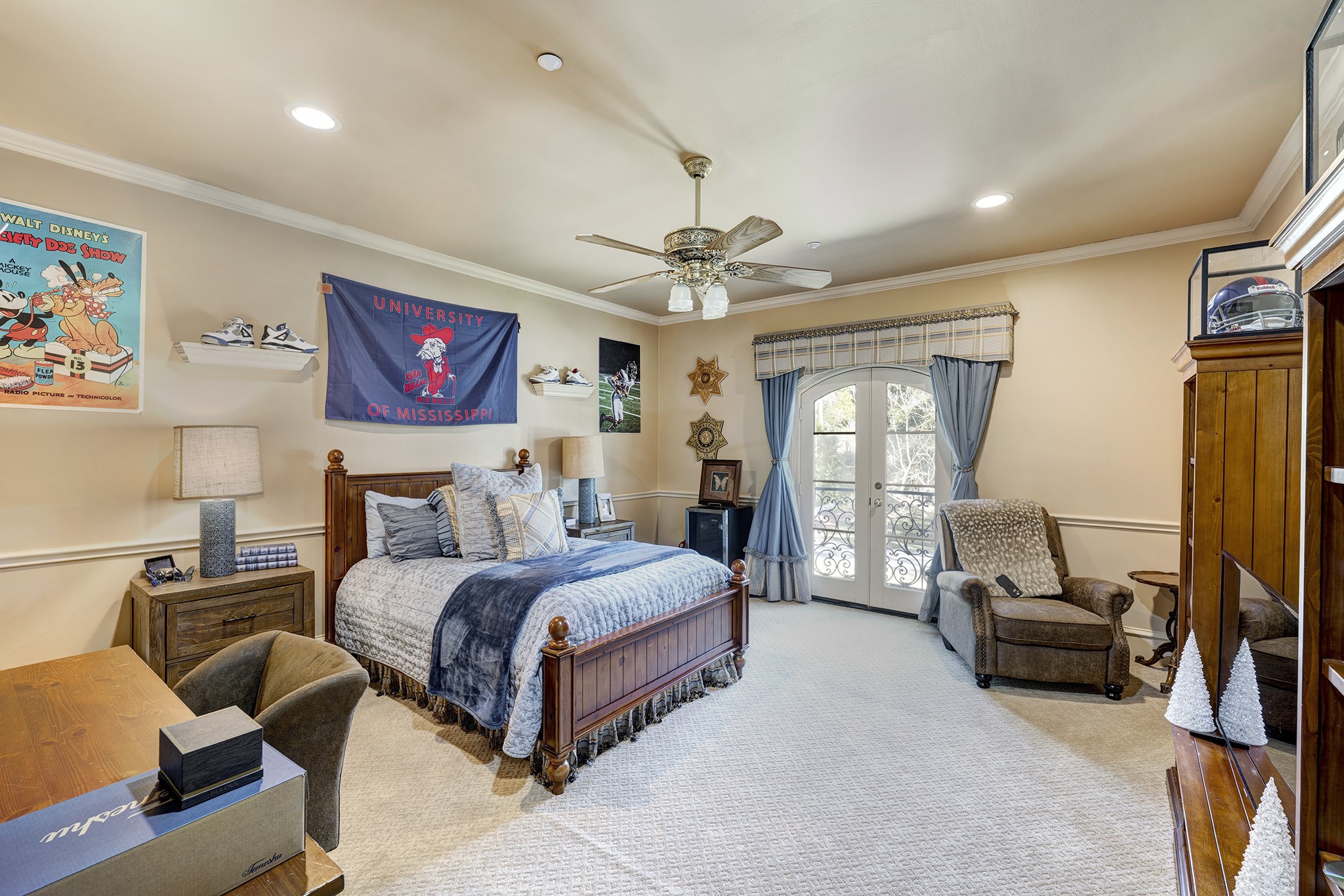 725 Blalock Road Houston, TX 77024 - Photo 20 of 27 a bedroom with a bed couch and a large window
