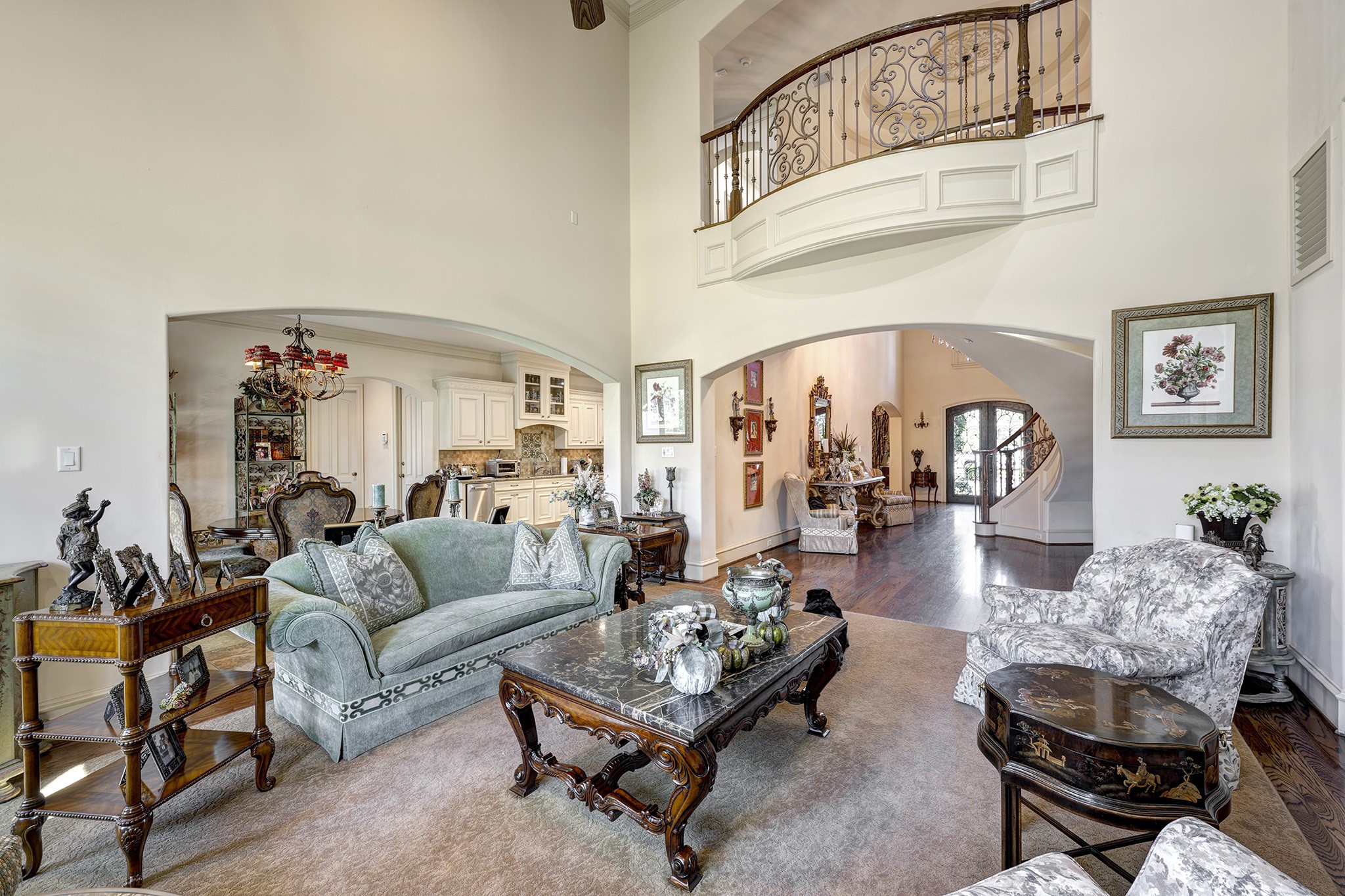 725 Blalock Road Houston, TX 77024 - Photo 5 of 27 a living room with furniture a rug and a chandelier