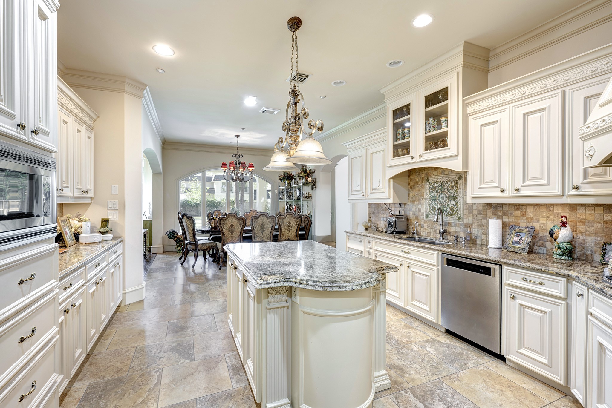 725 Blalock Road Houston, TX 77024 - Photo 7 of 27 a kitchen with sink cabinets and window
