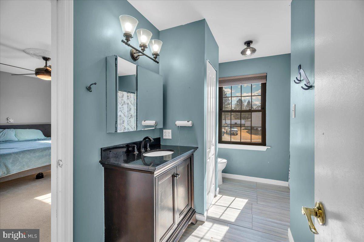 52 Borrelly Boulevard Sewell, NJ 08080 - Photo 17 of 24 a bathroom with sinks a vanity and a mirror