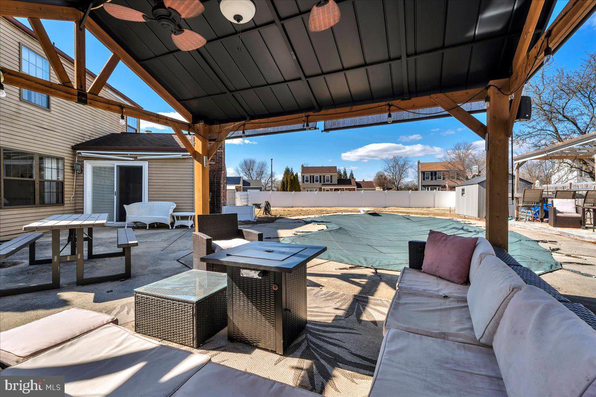 52 Borrelly Boulevard Sewell, NJ 08080 - Photo 21 of 24 a outdoor living space with patio furniture and a fireplace