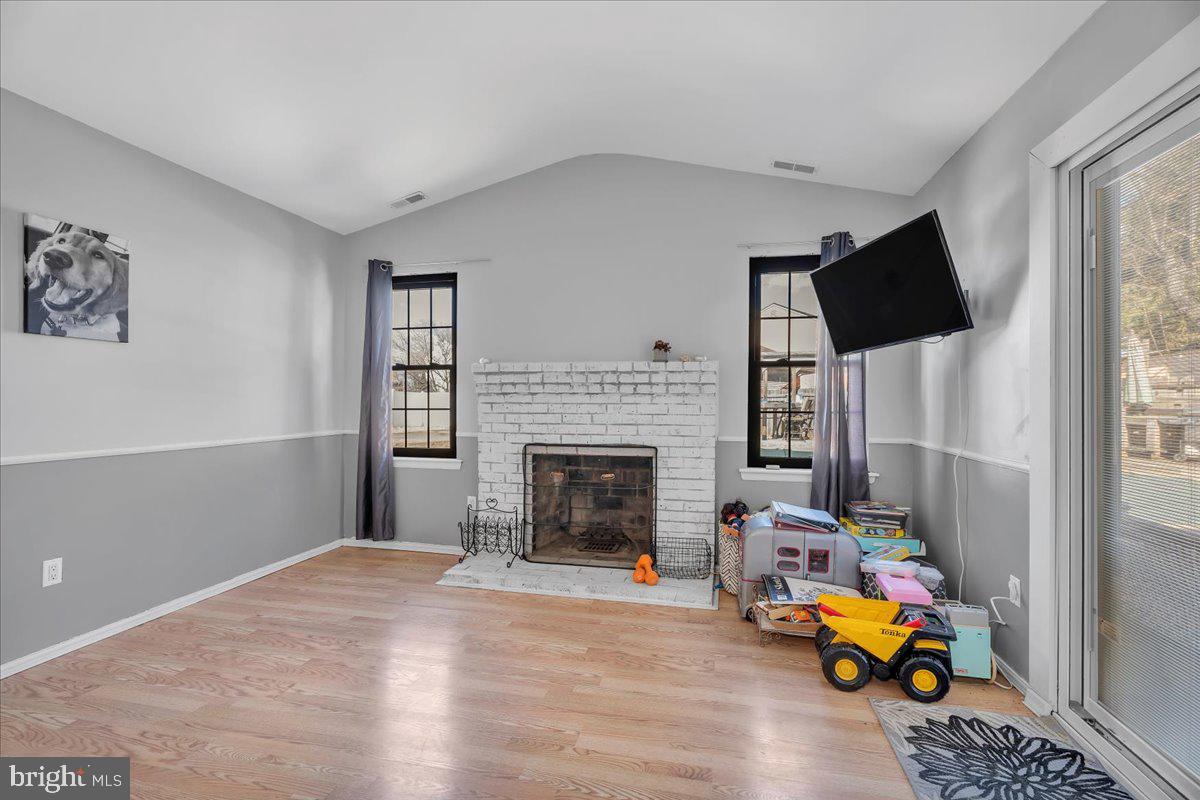 52 Borrelly Boulevard Sewell, NJ 08080 - Photo 10 of 24 a living room with furniture and a fireplace