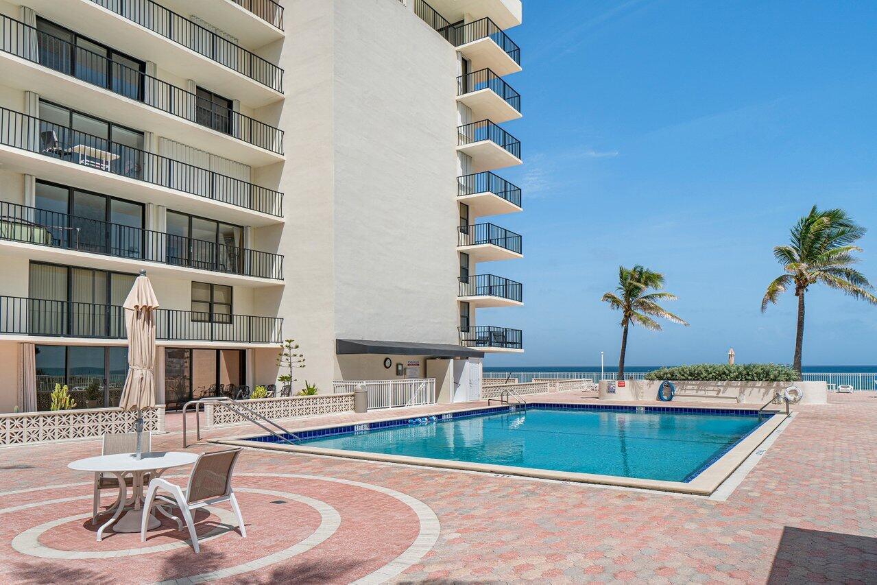 3460 South Ocean Boulevard, Unit 6150 Palm Beach, FL 33480 - Photo 30 of 34 a view of a swimming pool with chairs