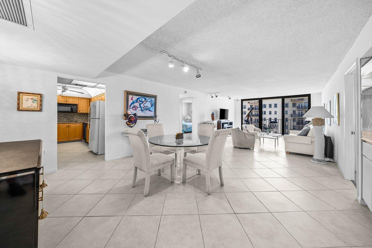 3460 South Ocean Boulevard, Unit 6150 Palm Beach, FL 33480 - Photo 3 of 34 a living room with couches and kitchen view