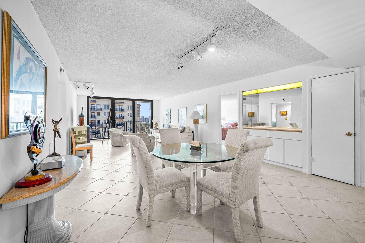 3460 South Ocean Boulevard, Unit 6150 Palm Beach, FL 33480 - Photo 4 of 34 a dining room with furniture and wooden floor