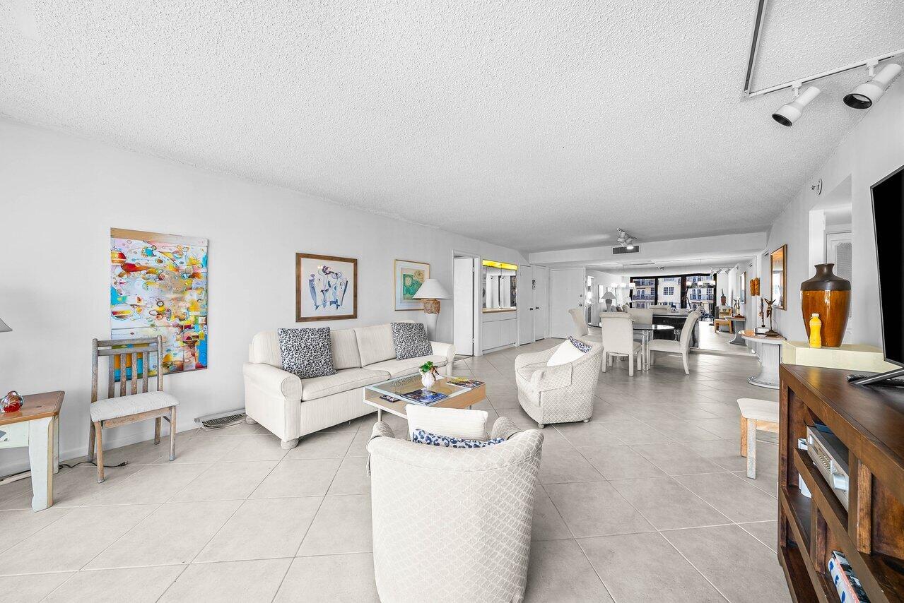 3460 South Ocean Boulevard, Unit 6150 Palm Beach, FL 33480 - Photo 8 of 34 a living room with furniture and wooden floor