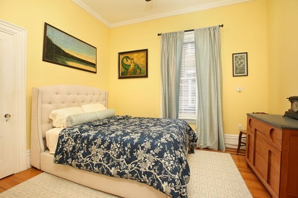 45 Orchard Street, Unit 1 Boston, MA 02130 - Photo 12 of 19 a bedroom with a bed and a cabinets