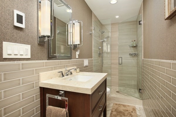 45 Orchard Street, Unit 1 Boston, MA 02130 - Photo 13 of 19 a bathroom with a sink shower and a mirror