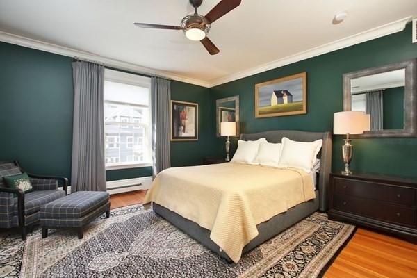 45 Orchard Street, Unit 1 Boston, MA 02130 - Photo 9 of 19 a bedroom with a bed wooden floor and window