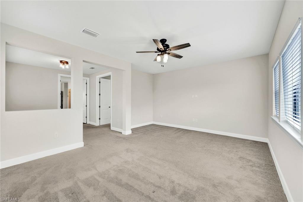 19176 Elston Way Estero, FL 33928 - Photo 11 of 26 a view of room with a ceiling fan and window