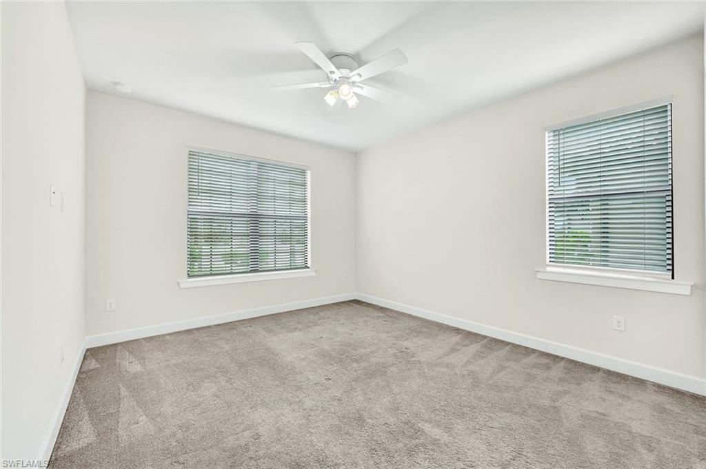 19176 Elston Way Estero, FL 33928 - Photo 16 of 26 an empty room with windows and fan