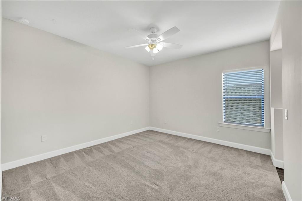 19176 Elston Way Estero, FL 33928 - Photo 18 of 26 an empty room with a window and a fan