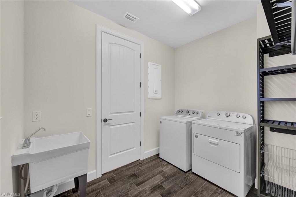 19176 Elston Way Estero, FL 33928 - Photo 23 of 26 a view of utility room with washer and dryer