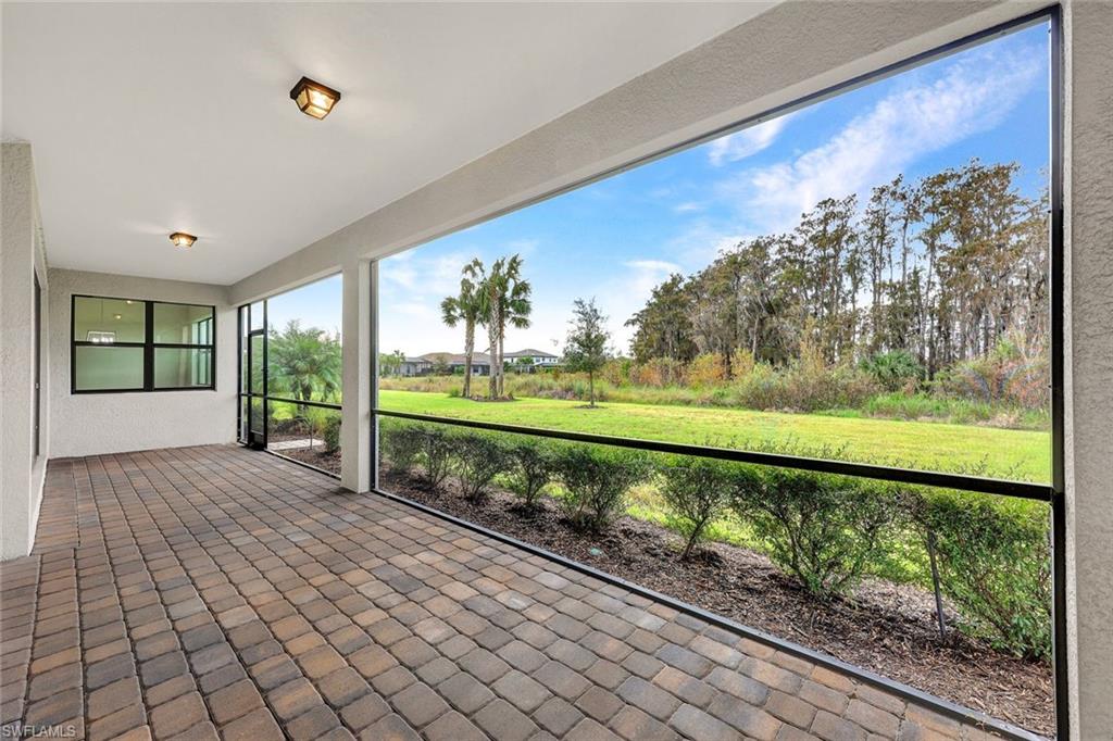 19176 Elston Way Estero, FL 33928 - Photo 24 of 26 a view of a back yard from a balcony