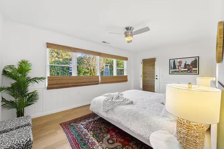 49 Prochnow Road Sedona, AZ 86336 - Photo 19 of 76 a bedroom with a bed and wooden floor