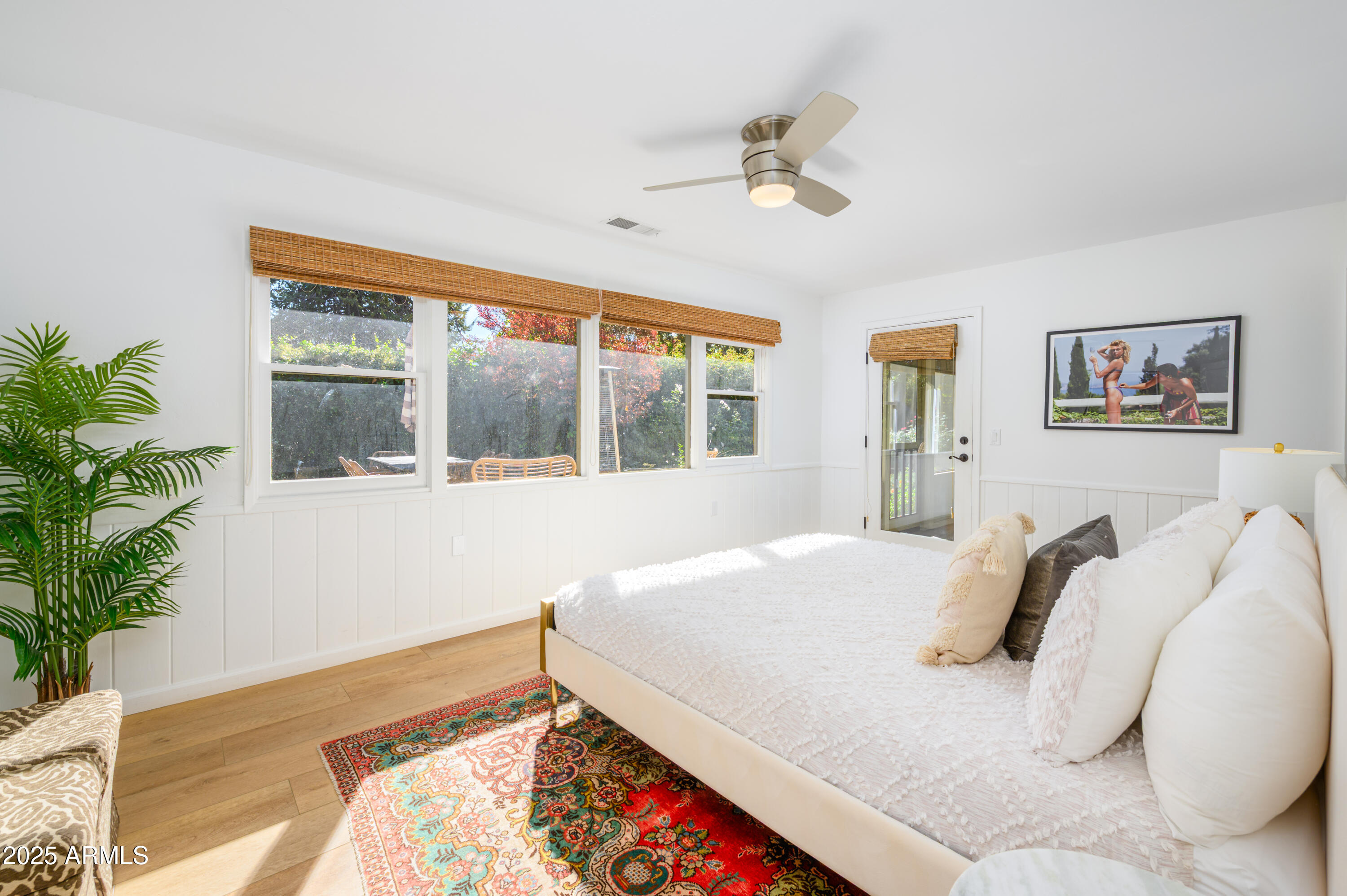 49 Prochnow Road Sedona, AZ 86336 - Photo 21 of 76 a bedroom with a bed and a potted plant