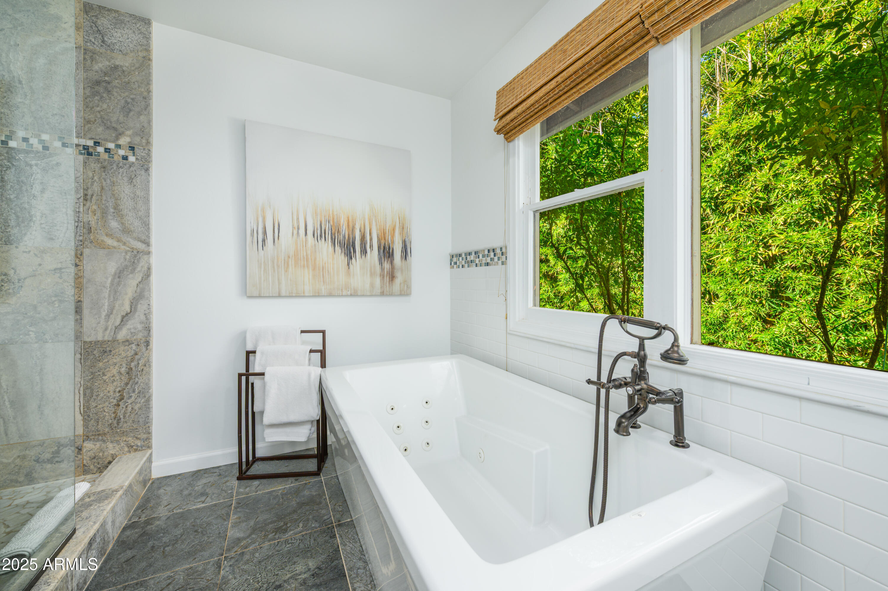 49 Prochnow Road Sedona, AZ 86336 - Photo 26 of 76 a white bath tub sitting in a bathroom next to a window
