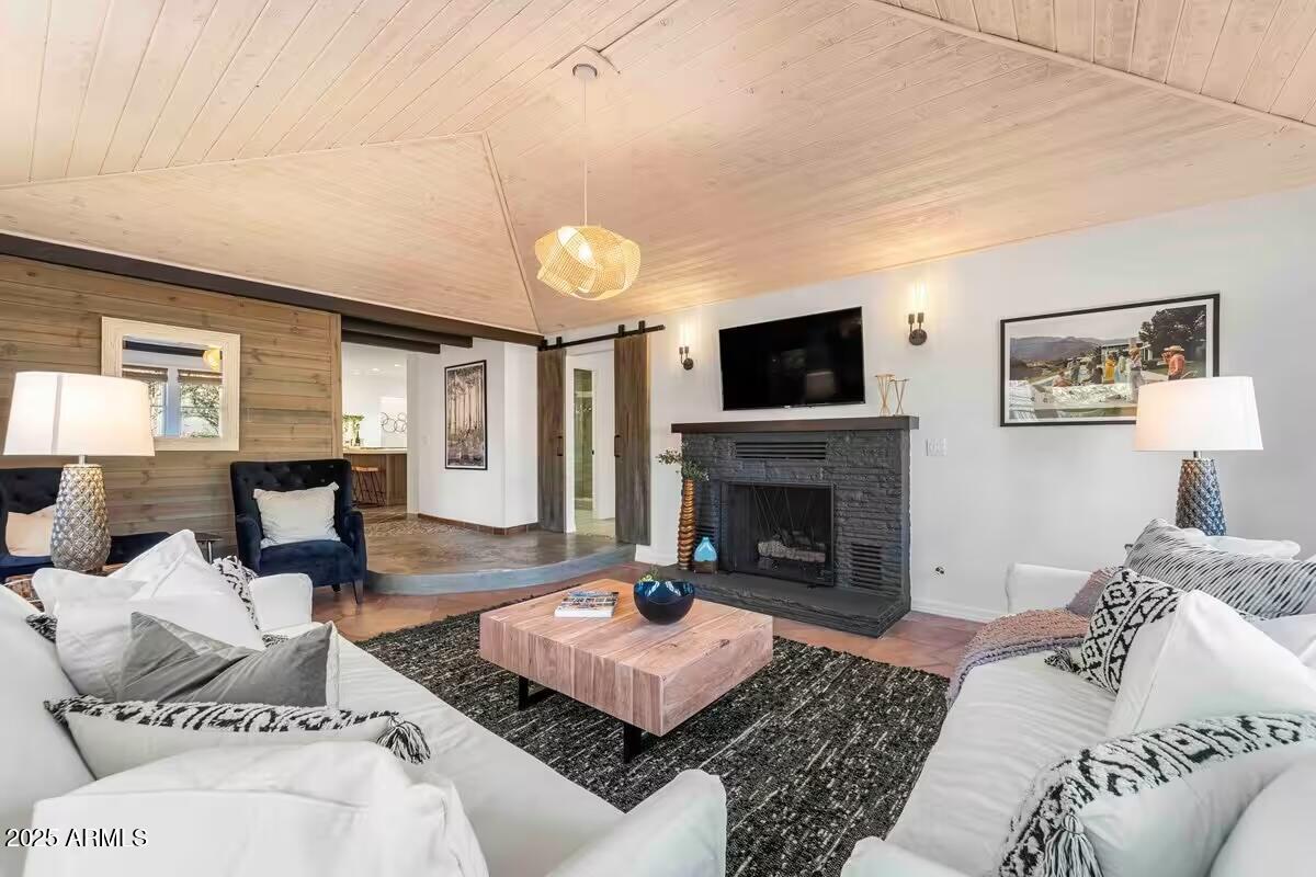 49 Prochnow Road Sedona, AZ 86336 - Photo 2 of 76 a living room with furniture and a fireplace