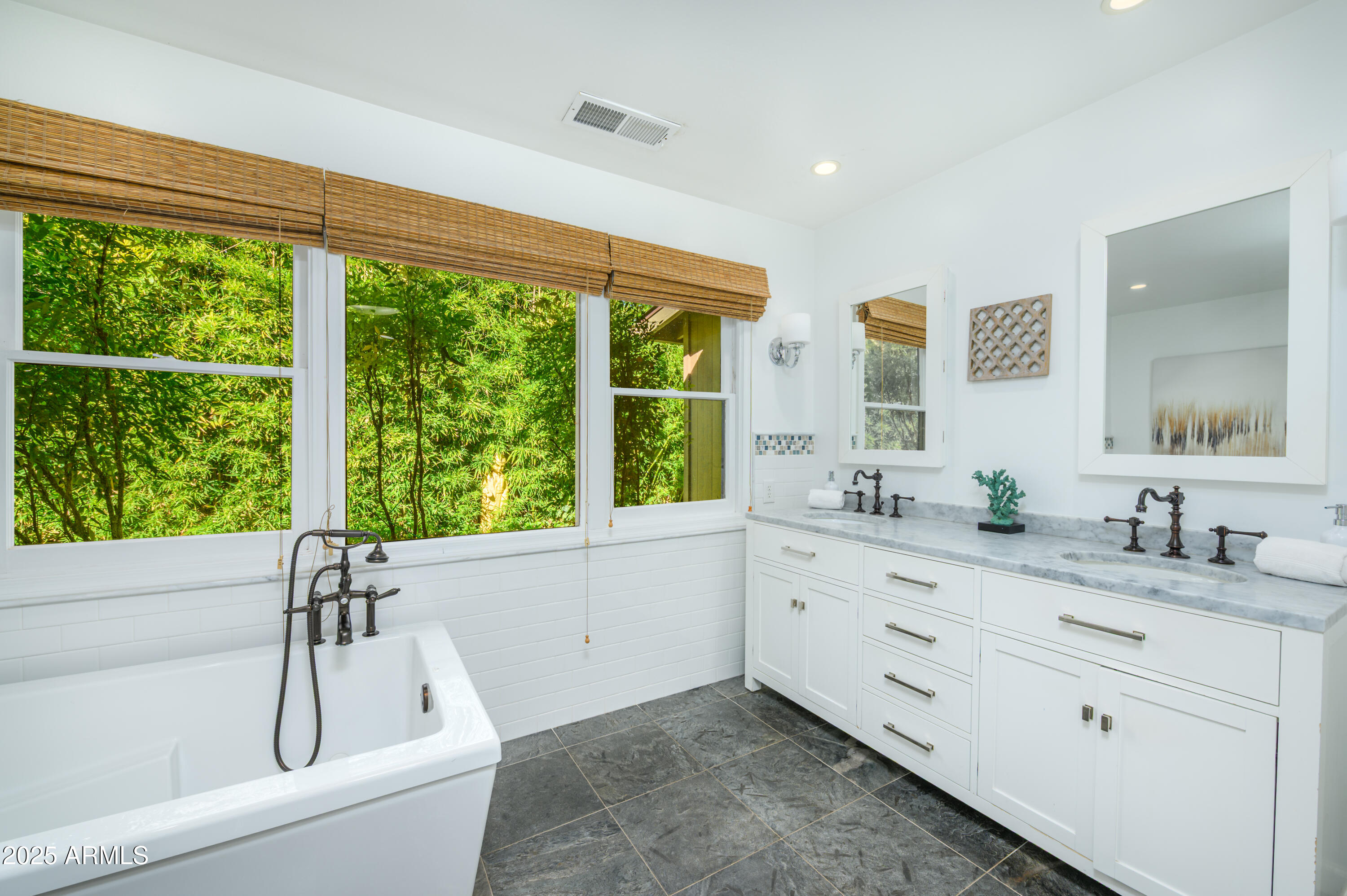 49 Prochnow Road Sedona, AZ 86336 - Photo 28 of 76 a bathroom with a granite countertop sink mirror and a large window