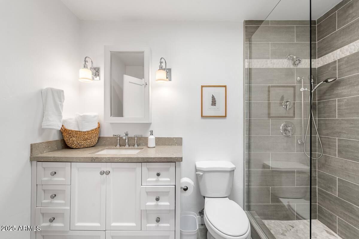 49 Prochnow Road Sedona, AZ 86336 - Photo 50 of 76 a bathroom with a granite countertop sink toilet and shower