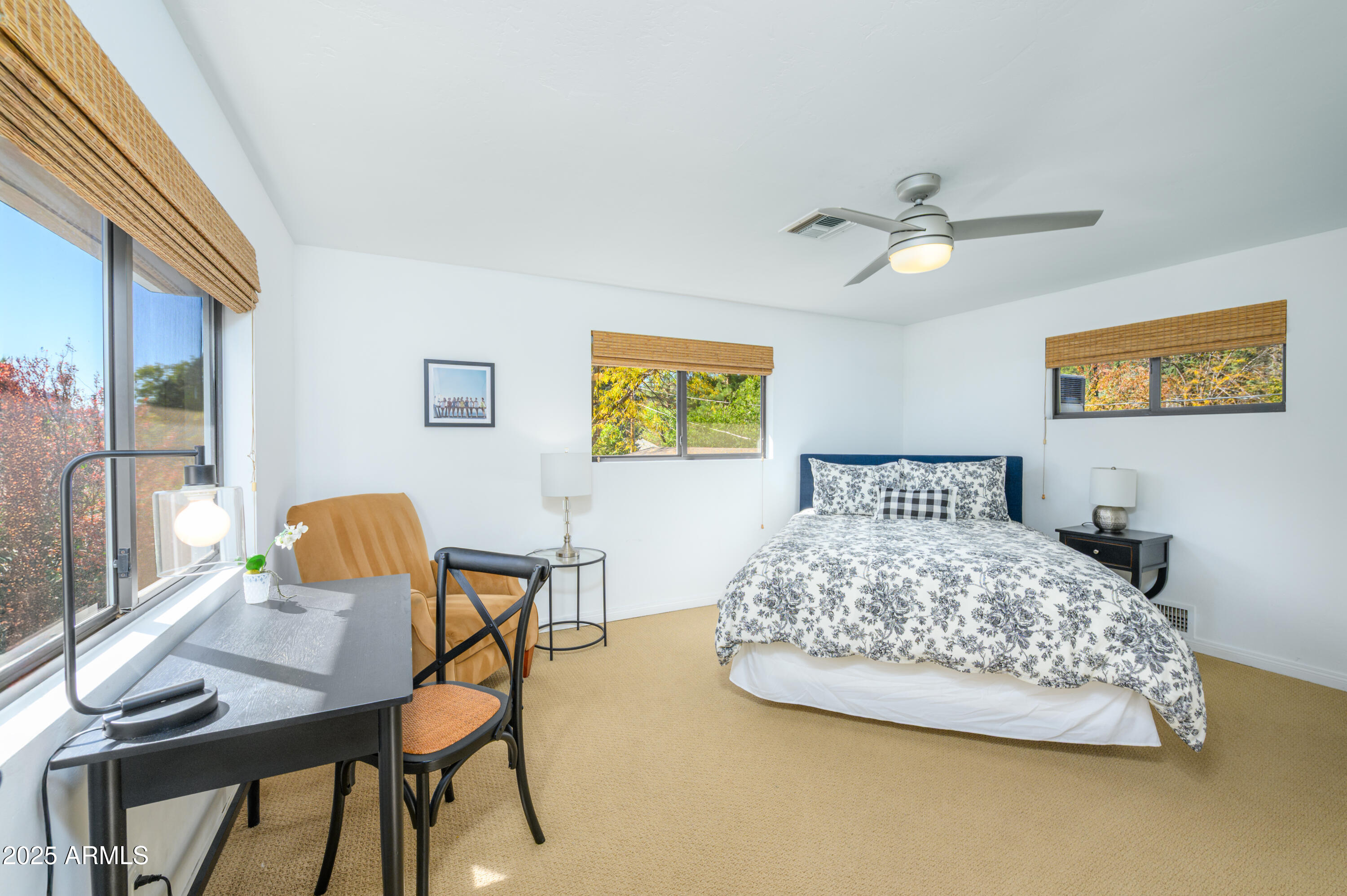 49 Prochnow Road Sedona, AZ 86336 - Photo 51 of 76 a bedroom with a bed and wooden floor