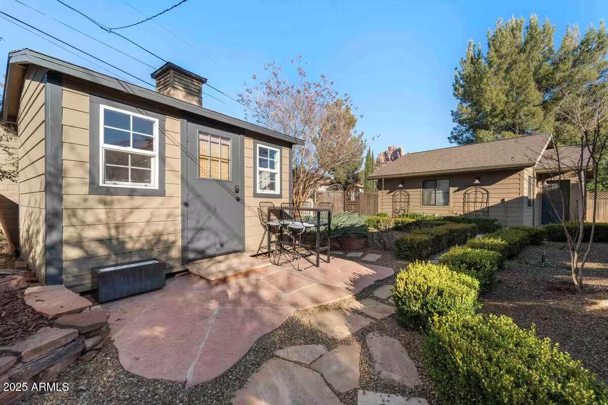 49 Prochnow Road Sedona, AZ 86336 - Photo 56 of 76 a view of a house with backyard and sitting area
