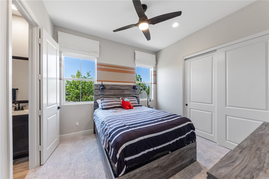 7631 Capstone Court Riverside, CA 92506 - Photo 16 of 39 Comfortable secondary bedroom with mirrored closet doors.