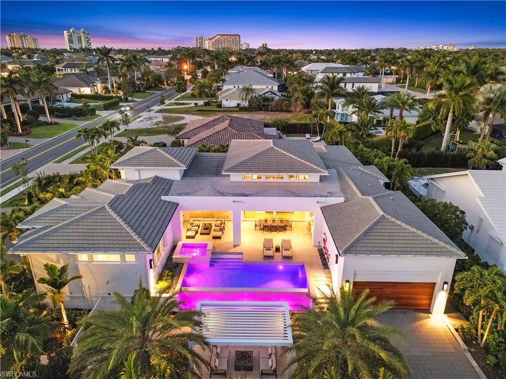 4220 Crayton Road Naples, FL 34103 - Photo 2 of 27 an aerial view of residential houses with outdoor space and swimming pool