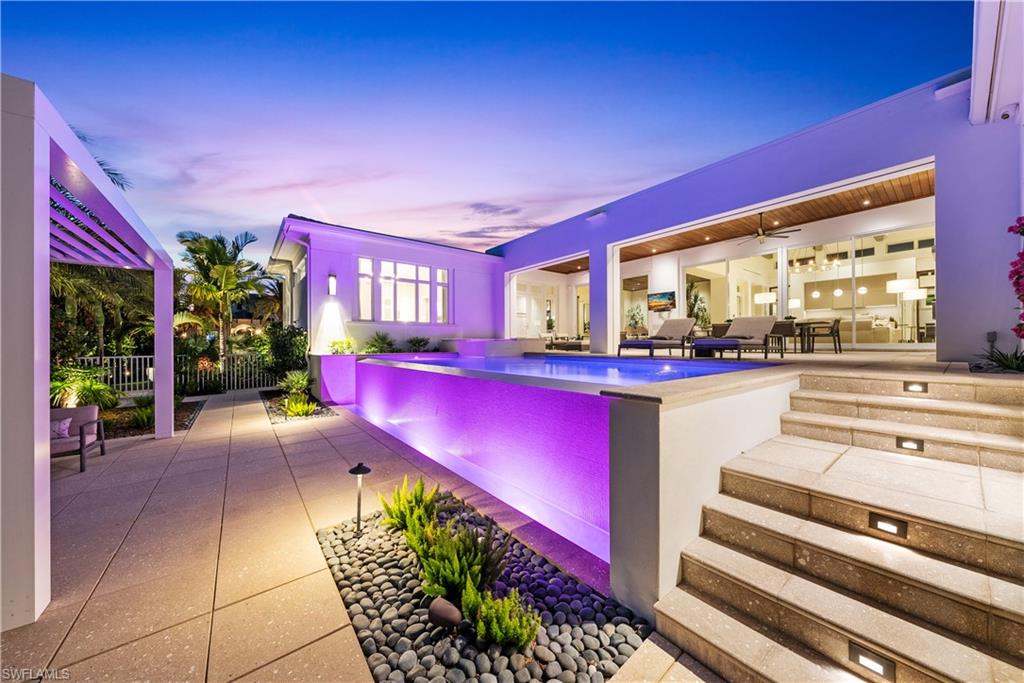 4220 Crayton Road Naples, FL 34103 - Photo 23 of 27 a view of a lobby with chair and tables