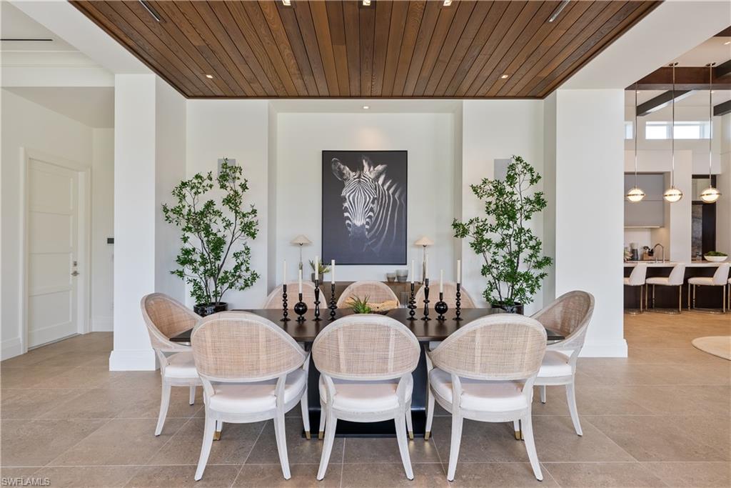 4220 Crayton Road Naples, FL 34103 - Photo 3 of 27 a dining room with furniture and window