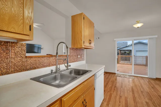 a kitchen with a sink and a microwave