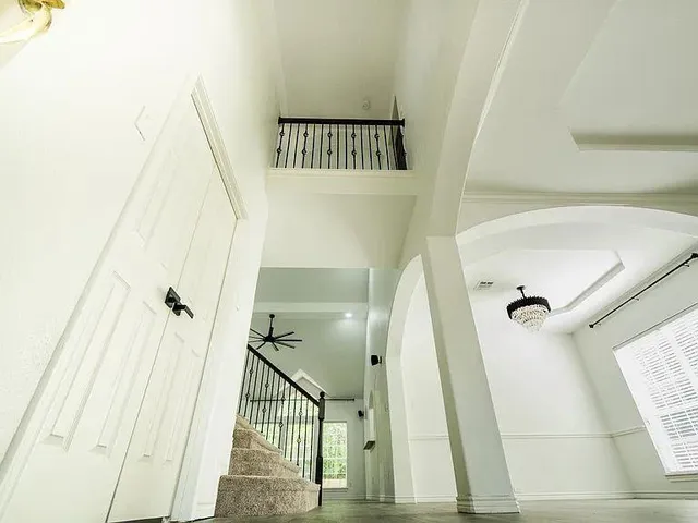 a view of a hallway view with staircase