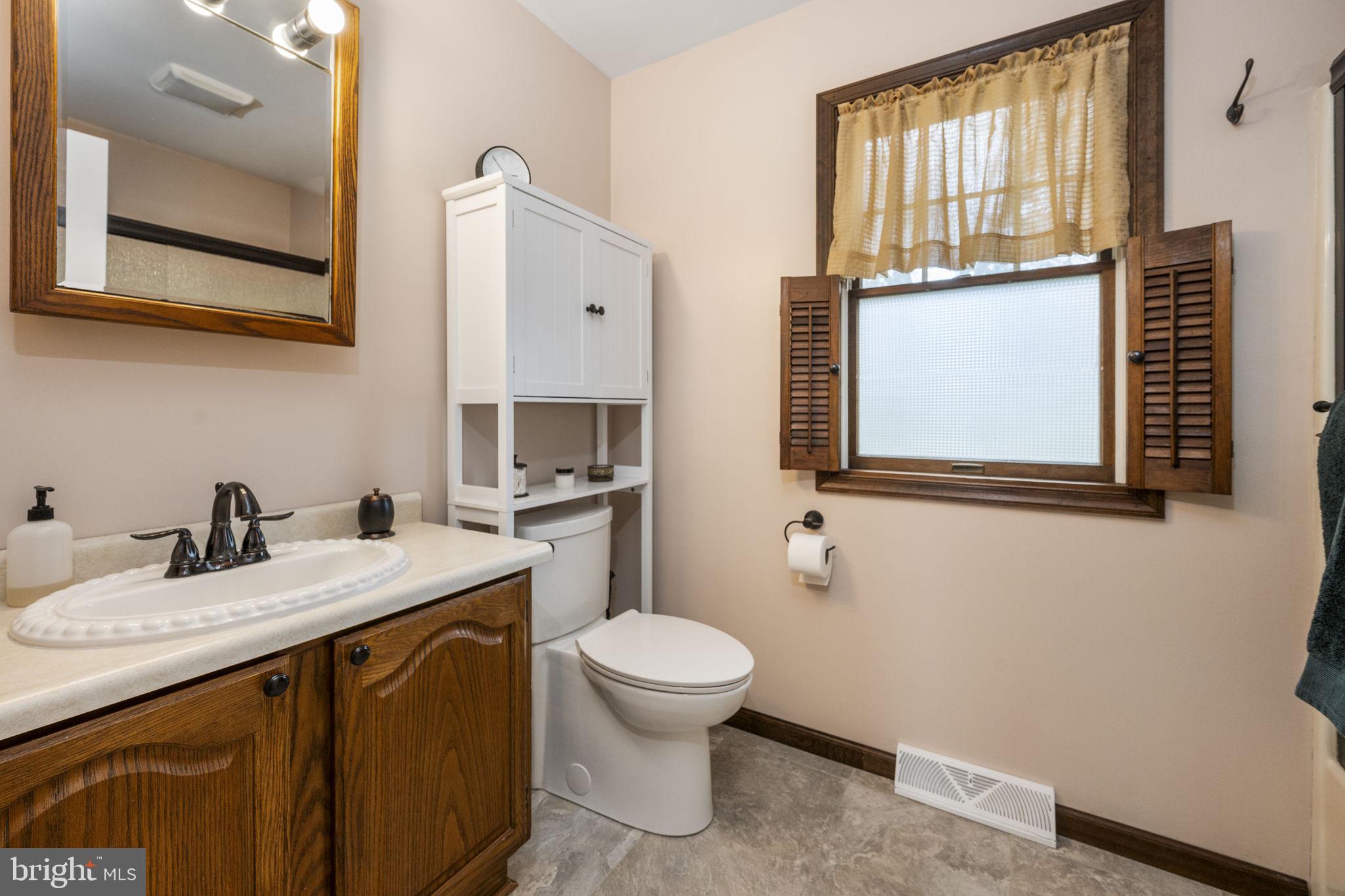 558 Crosswinds Drive Lititz, PA 17543 - Photo 14 of 31 a bathroom with a granite countertop sink toilet and mirror